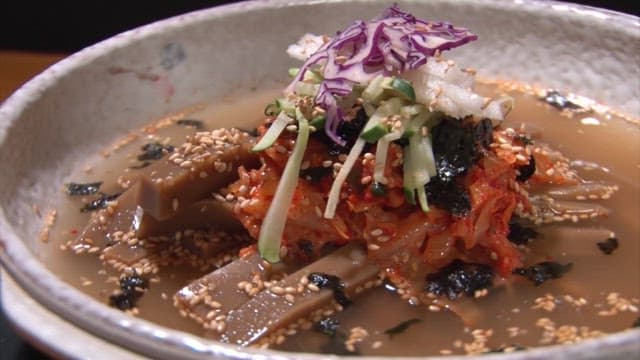 Bowl of Acorn Jelly with Plenty of Vegetables and Broth