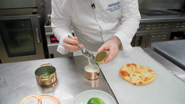 Chef Preparing Gourmet Meal in Kitchen