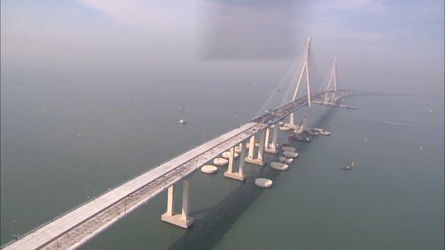 Incheon Bridge with marathon runners running
