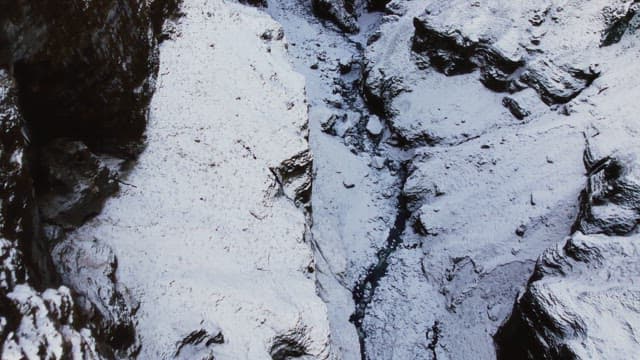 Snow-covered mountains with a deep gorge