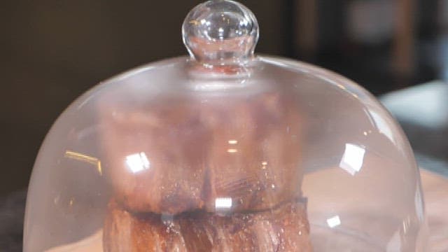Steak in a glass dome