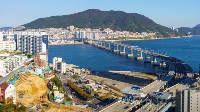 Busan's day-to-night scenery with high-rise buildings along the coast