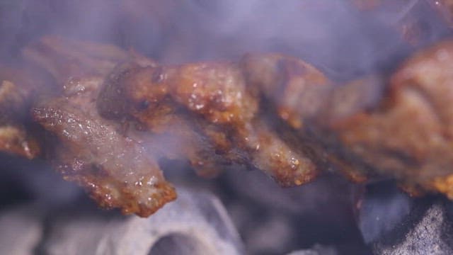 Juicy mutton sashlik grilling over charcoal