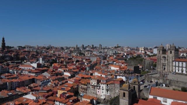 Historic Cityscape with Buildings with Red Rooftops on a Clear Day