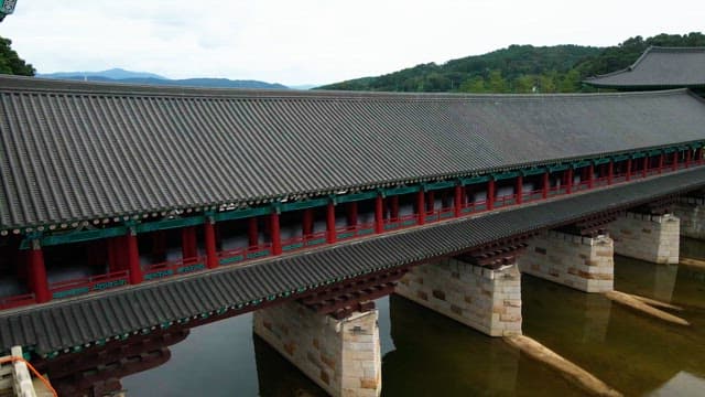 Traditional Korean bridge over a calm river