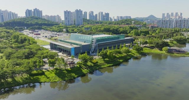 Cityscape with a river and greenery