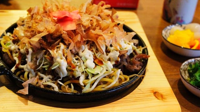 Delicious Yakisoba topped with katsuobushi and vegetables