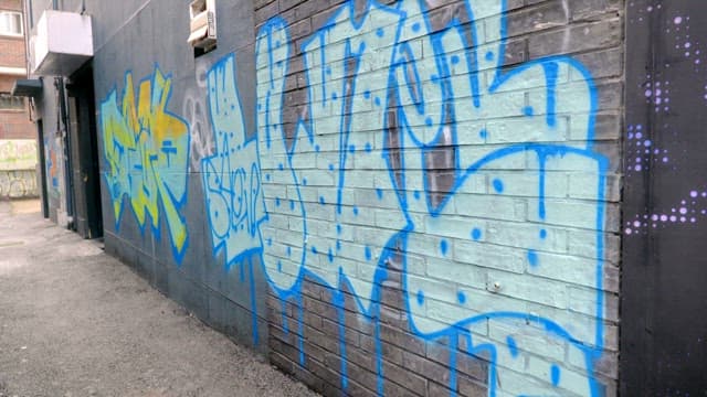 Graffiti on a city alley wall