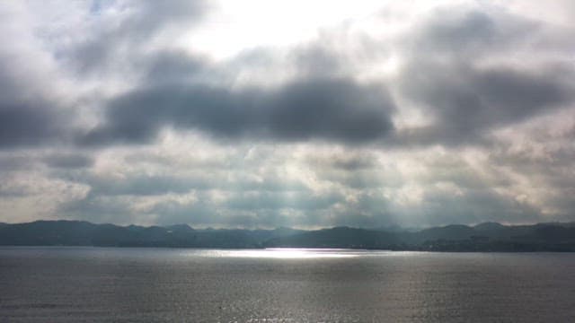 Calm seascape under a cloudy sky