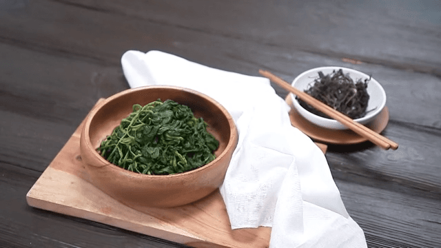 Freshly Prepared Korean Thistle with Chopsticks on a Wooden Table