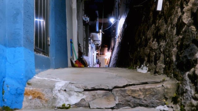 Narrow alleyway with dim lighting