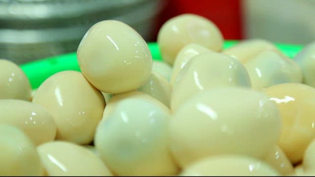 Pile of peeled boiled eggs