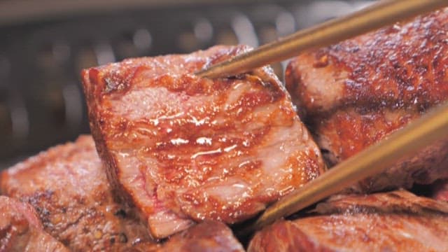 Sizzling Juicy Steak on a Grill