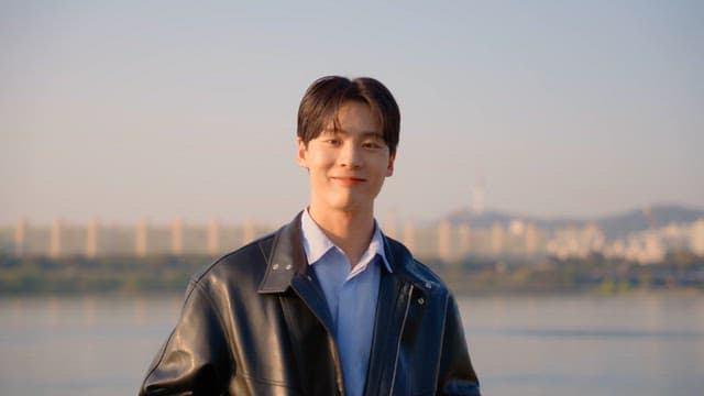 Smiling man by the riverside