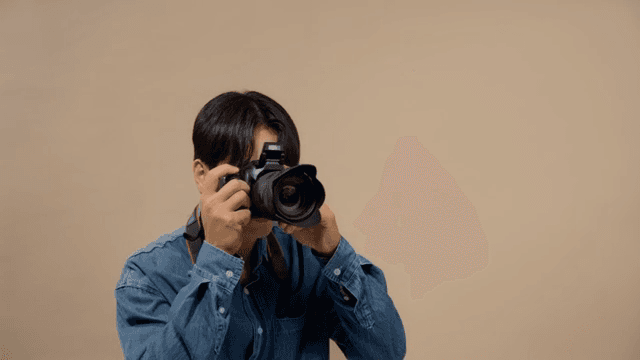 Man taking pictures with a DSLR camera