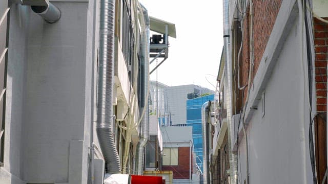 Narrow alley between urban buildings