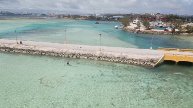 Coastal walkway with clear blue sea