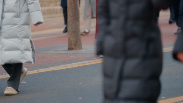 People walking on a sidewalk