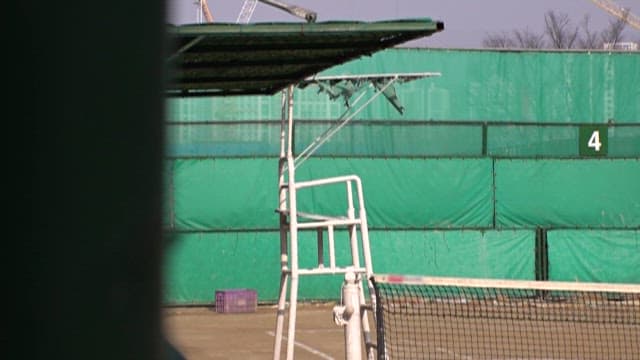Seat for Judge Next to a Quiet Tennis Court
