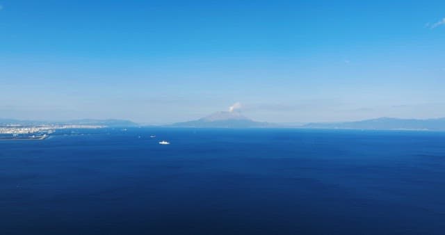 Vast ocean with distant mountains