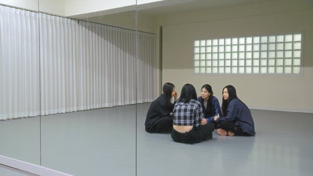Young women resting in a dance studio