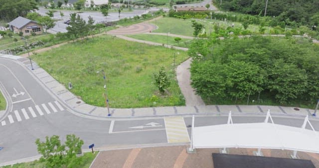 View of a green park with pathways