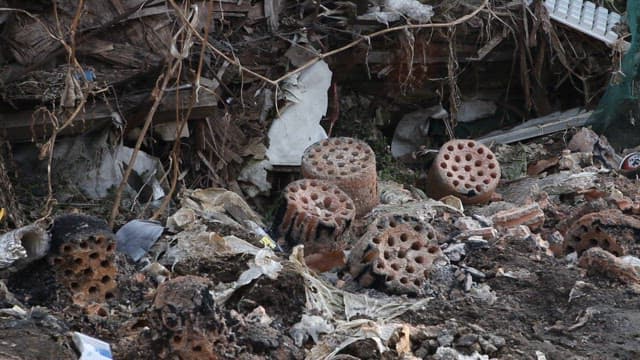 Broken Briquettes and Dirt Scattered on the Floor