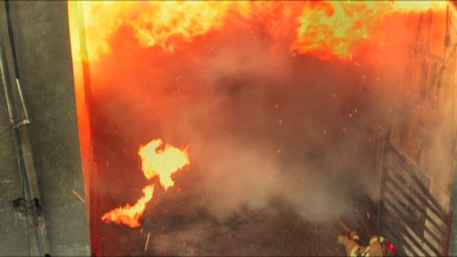 Firefighters Falling Down while Extinguish Massive Building Fire