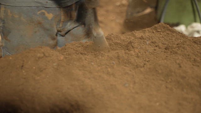 Scene of soil being compacted with a machine