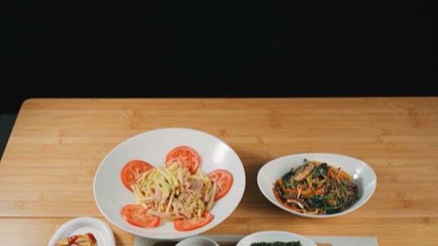 Korean Food Neatly Arranged on a Wooden Table