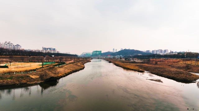 River and Cityscape on a Cloudy Day