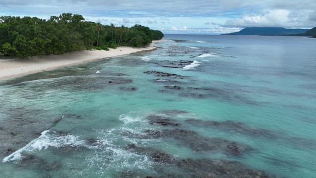 Serene beach with clear emerald water