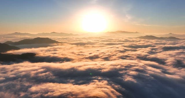 Sunset over clouds and mountains