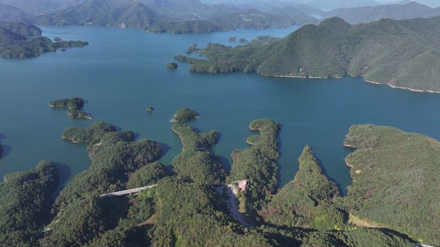Serene Lakes Amidst Rolling and Lush Forested Hills