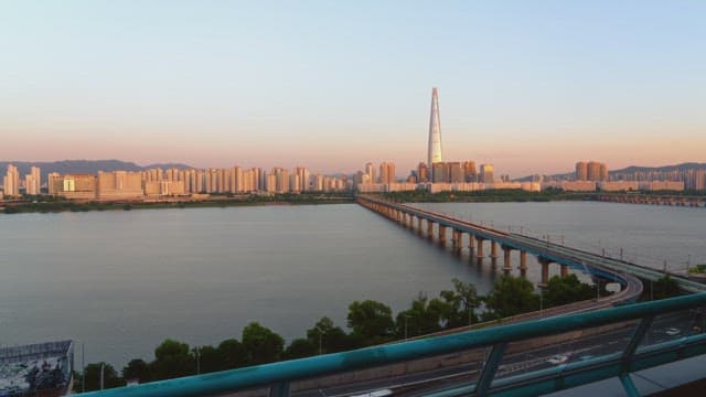City skyline with a river and bridge