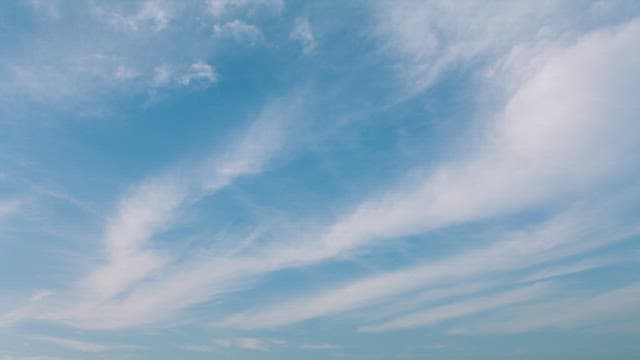 Expansive Blue Sky with Wispy Clouds