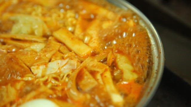 Spicy tteokbokki with ramen boiling in a pot