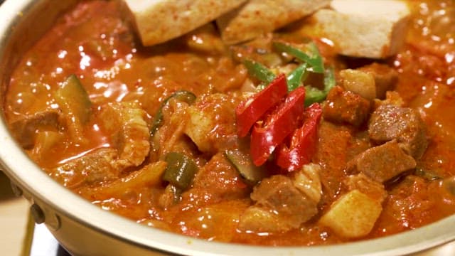 Simmering Spicy Pork Kimchi Stew in a Nickel Silver Pot