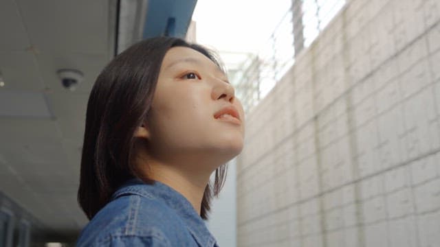 Woman breathing fresh air through the window