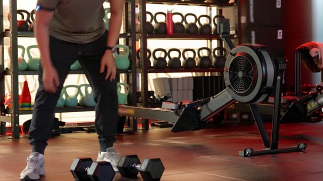 Person exercising in a gym with equipment