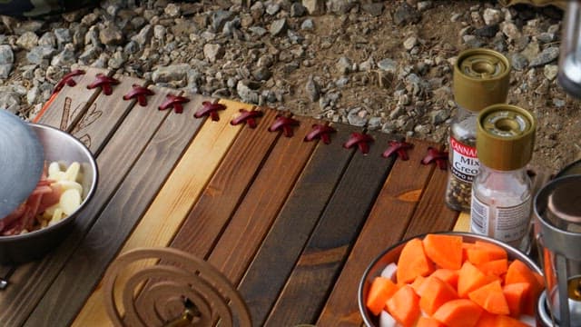 Preparing seasoned chicken at a campsite