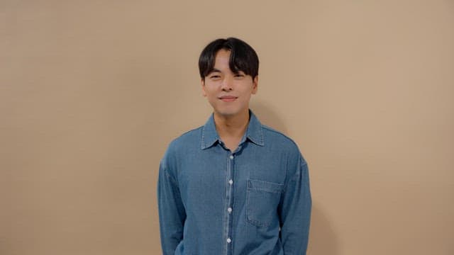 Man with a smile and a satisfied expression