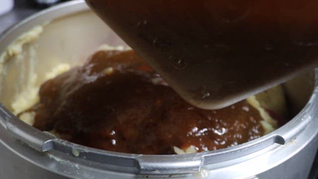 Adding Sliced Pineapples and Sauce to the Dish