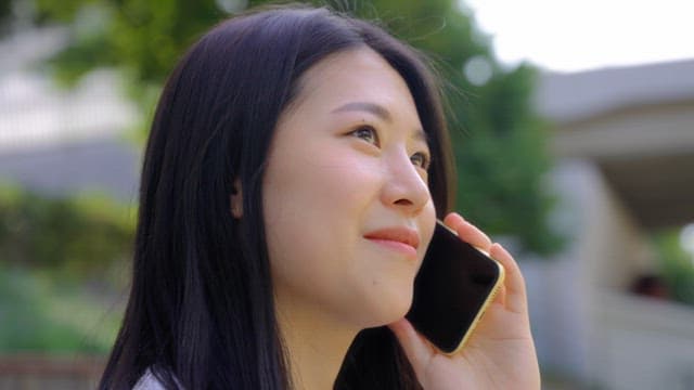 Woman talking on the phone outdoors