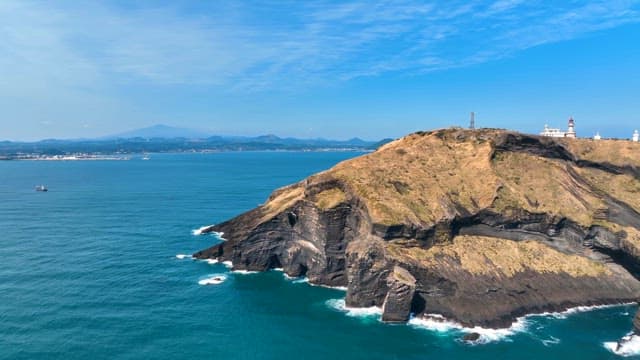 Scenic coastal cliff with a lighthouse