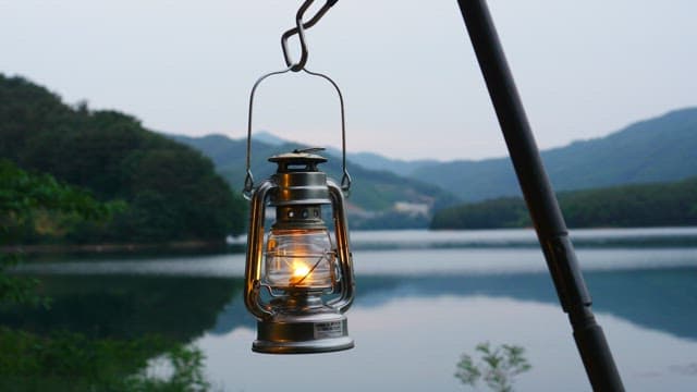 Lanterns lighting up the quiet lakeside in the evening