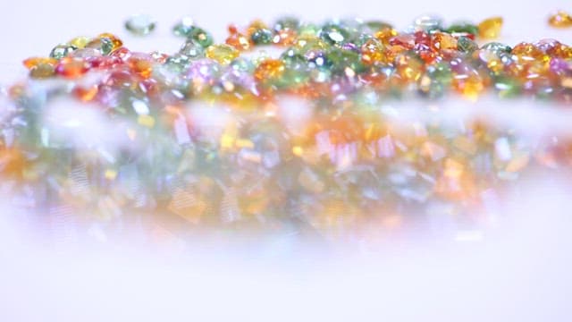 Close-up of colorful gemstones in a scattered arrangement.