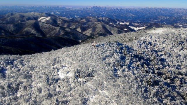 Observation deck on top of a white snow-covered mountain and magnificent view