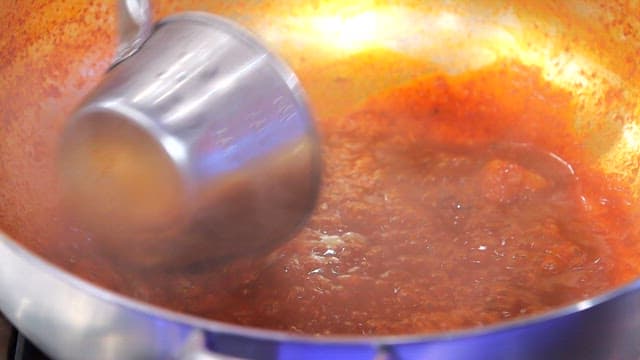 Spicy sauce simmering in a pot