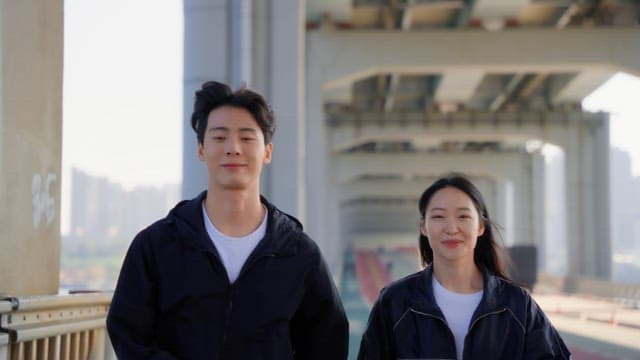 Couple jogging on a jamsu bridge